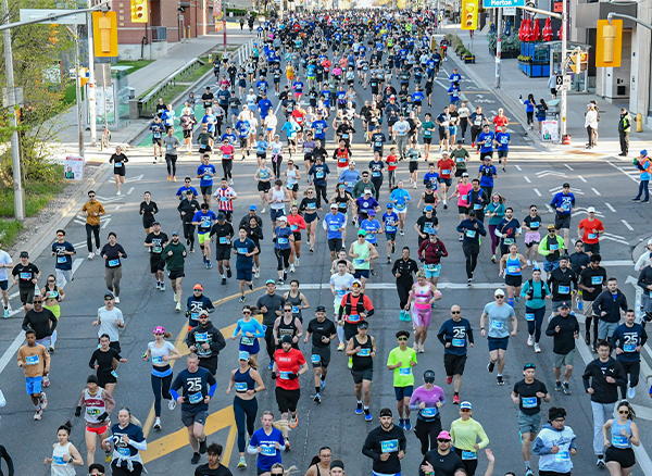 sl10k-2025-image-merton Sporting Life 10K 2024 Runners in front of the CN Tower